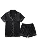 Black satin pyjama set with white piping, short sleeve shirt and shorts