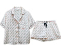 White satin love-print night suit with black piping – shirt and shorts